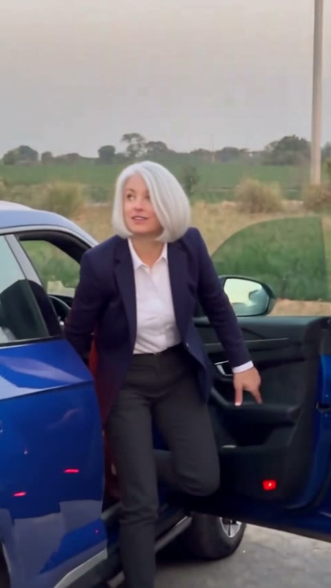 Gas station dance trend shot 3: stepping out of a parked car